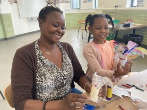 Mother and daughter making crafts