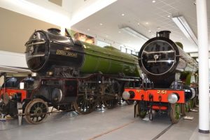 Two locomotives in the Rail Heritage Centre space.