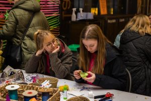 Two young people engaging in crafts